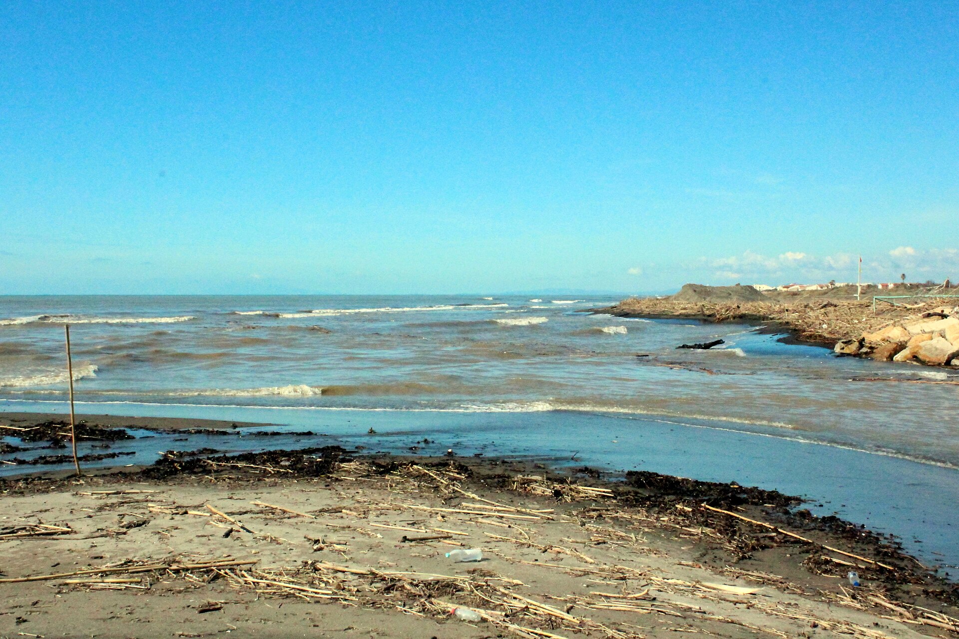 Blue water and shoreline at the Marta river mouth